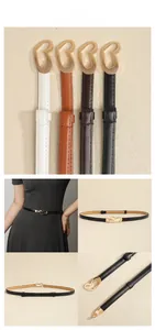 Close-up showing four elegant leather belts with gold heart buckles for women dresses