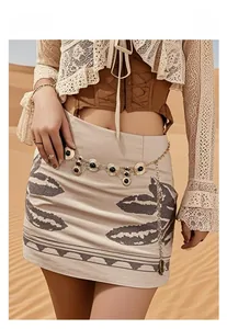 Detail of bohemian gold waist chain with black stones shown in a desert setting