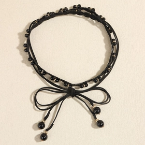 Elegant multi-layer black beaded choker with gold rhinestone accents and ribbon tie