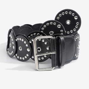 Detail of western black leather belt with silver rivets and polished metal buckle