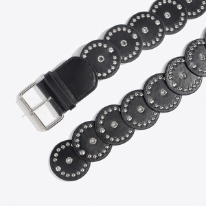 Close-up of western leather belt with round silver studs and eyelets on white background