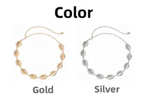 Close-up of gold and silver oval chain belts with radial brushed texture details