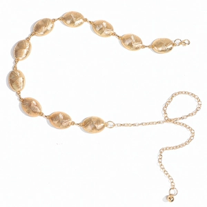 Close-up of golden oval chain belt showing brushed metal texture and adjustable link chain