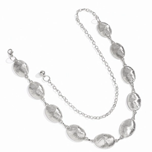 Detail of silver oval textured metal chain links with adjustable lobster clasp closure