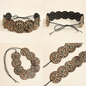 Detail of leopard print disc belt with turquoise beads and retro metal accents