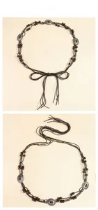Detail view of Bohemian braided waist chain with vintage metal charms and wooden beads