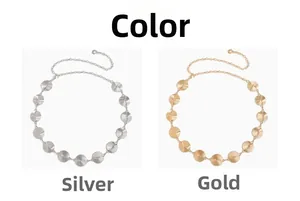 Detail view of round spiral textured metal belts in elegant silver and gold finishes