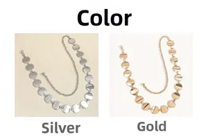 Detail view of round disc metal waist chains in shiny gold and silver finishes