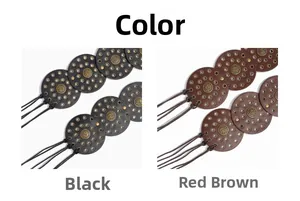 Detail of bohemian leather belts in black and reddish brown with vintage metal discs