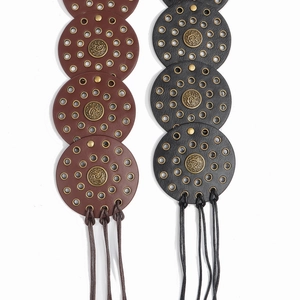 Western style wide waist belt with gold eyelets and bronze medallions in black and brown
