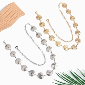 Elegant gold and silver metallic waist chains with textured round discs for dresses