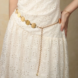Elegant gold geometric metal waist chain belt on a white dress for women summer style