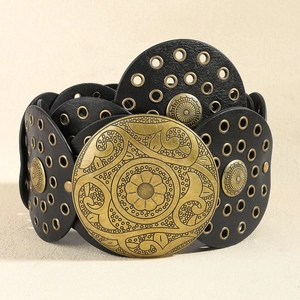 Detail of bohemian black wide corset belt with vintage brass metal buckles and eyelets