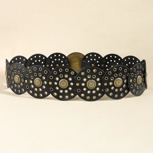 Detail of bohemian black waist belt with gold embossed buttons and metal eyelets