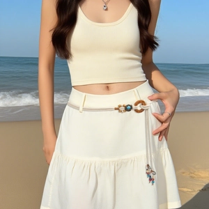 Bohemian braided waist belt with wooden buckle and fringe on summer beach skirt