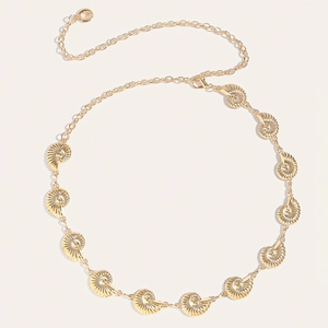 Detailed close-up of golden shell chain belt with spiral texture and adjustable link
