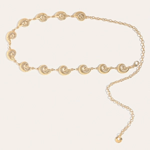 Detail of golden metal waist chain with conch shell pendants and adjustable clasp