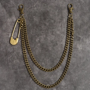 Detail of vintage bronze double layer punk waist chain with safety pin and lobster clasps