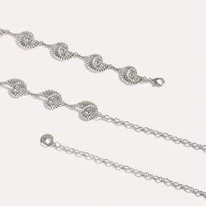 Close-up of silver nautilus seashell metal waist chain with lobster clasp and adjustable links