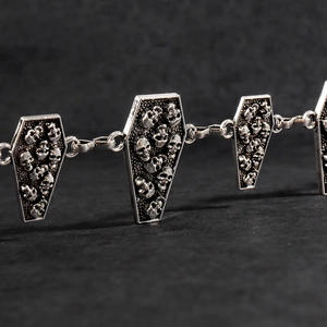 Gothic silver metal waist chain with coffin-shaped skull charms for a punk aesthetic