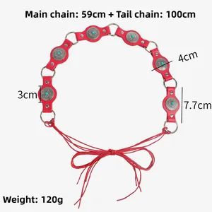 Detail view of ethnic red leather belt with turquoise beads and silver metal rings