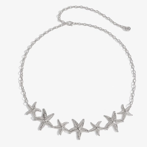 Detailed close-up of a silver starfish waist chain with textured metal starfish charms