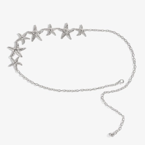 Detail of silver starfish waist chain featuring textured charms and adjustable lobster clasp