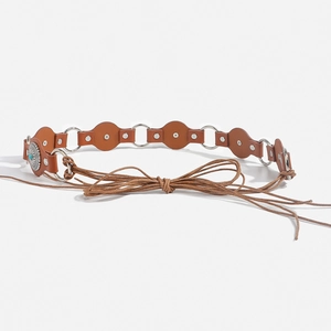 Detailed view of bohemian vintage belt featuring turquoise inlay and metal ring buckle
