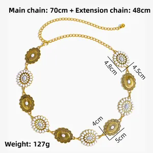Detailed view of ethnic gold waist chain with marble stones and floral relief patterns