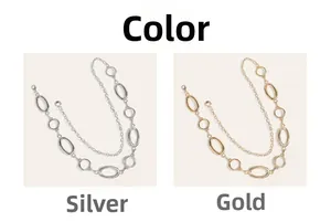 Detail of layered oval and round link waist chains in polished gold and silver finishes