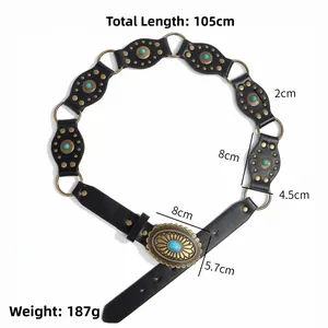 Detail of western cowgirl belt with turquoise stones and bronze rivets on black leather