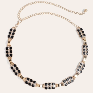 Chaîne de taille dorée élégante avec motifs floraux noirs et cristaux pour robe