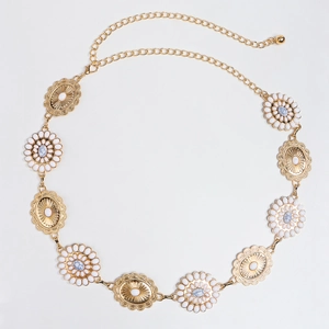 Detail of bohemian gold waist chain with blue marble stones and white daisy charms