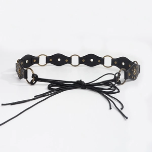 Detail of bohemian black leather waist belt with bronze rings and braided knot tie