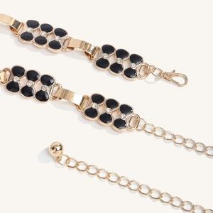 Chaîne de taille dorée chic avec trèfle en émail noir et strass pour les robes