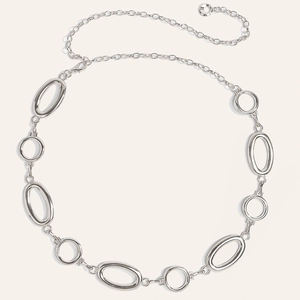 Detail view of silver metal waist chain with oval rings and adjustable lobster clasp closure