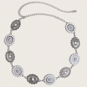 Detail of silver bohemian metal waist chain featuring floral patterns and marble stones