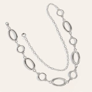 Polished silver metal body chain featuring hollow oval links and adjustable lobster clasp