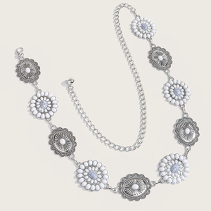 Detail view of retro silver waist chain with blue beads and sunburst medals