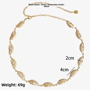 Detail of golden feather body chain with adjustable tail and lobster clasp decoration