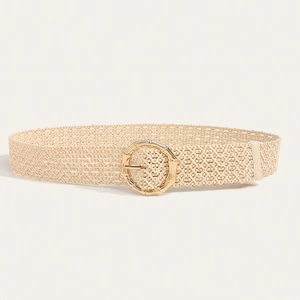 Detailed view of bohemian woven straw belt with a textured golden bamboo buckle