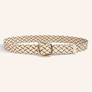 Close-up of woven bohemian belt featuring geometric textures and a gold alloy buckle
