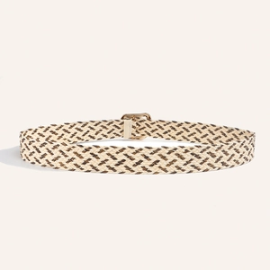 Detailed view of bohemian woven belt with chevron pattern and gold square buckle