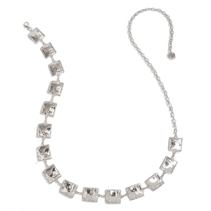 Detailed macro view of silver hammered texture square metal link belt with rose charm