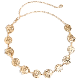 Detail of gold metal waist chain with textured round discs and floral charms decoration