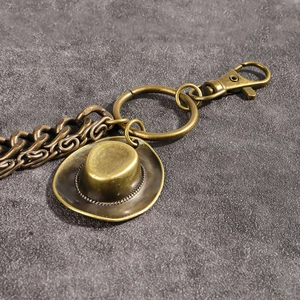 Double-layer punk style metal pant chain with a vintage cowboy hat pendant decoration