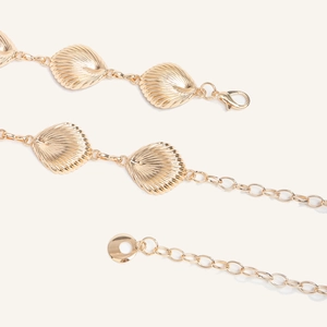 Bohemian gold metal waist chain featuring textured shell pendants and lobster clasp