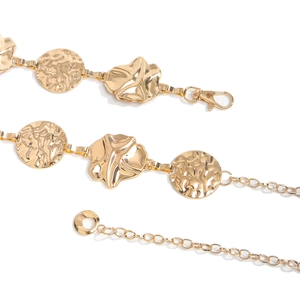 Detail of gold hammer-textured metal discs and flower chain belt with lobster clasp closure