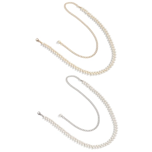 Detailed macro view of woven pearl body chain with adjustable lobster clasp in gold and silver