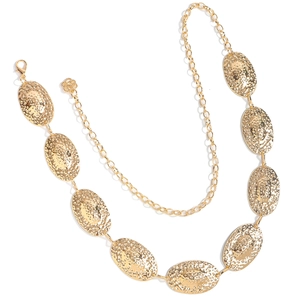 Detailed macro view of gold geometric oval buckle waist chain with hammered texture